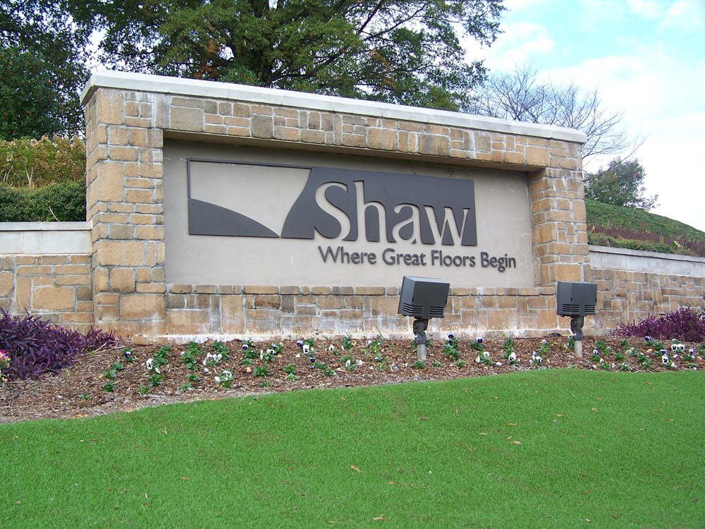 a shaw sign in front of a building